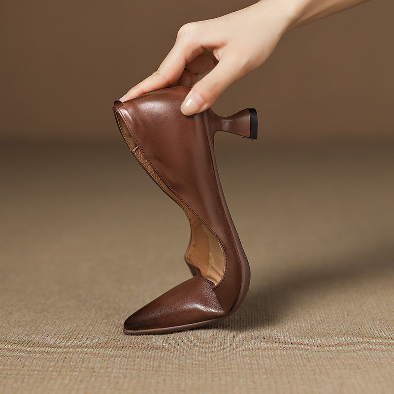 Calenne Leather Kitten Heels" can be rephrased as "Calenne Elegant Leather Kitten Heels.