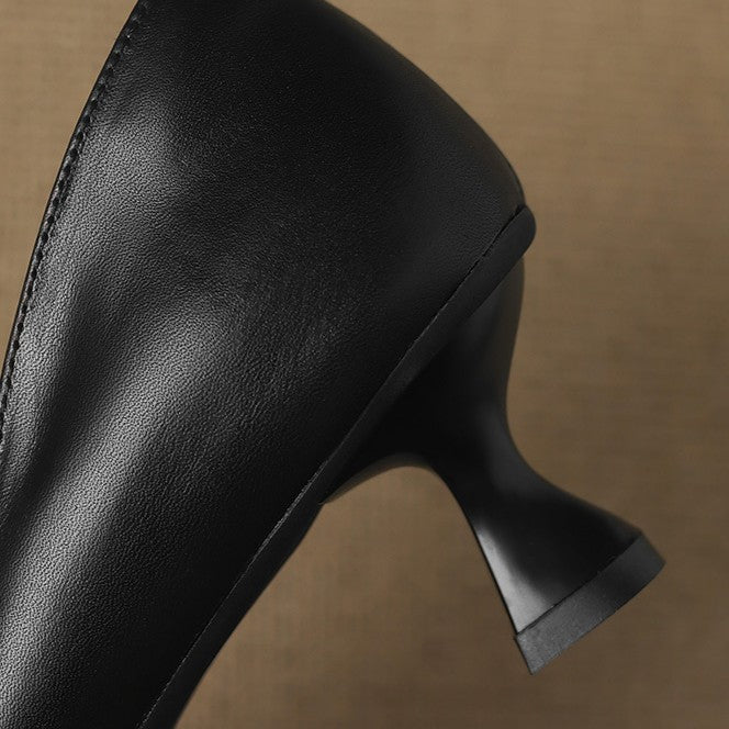 Calenne Leather Kitten Heels" can be rephrased as "Calenne Elegant Leather Kitten Heels.